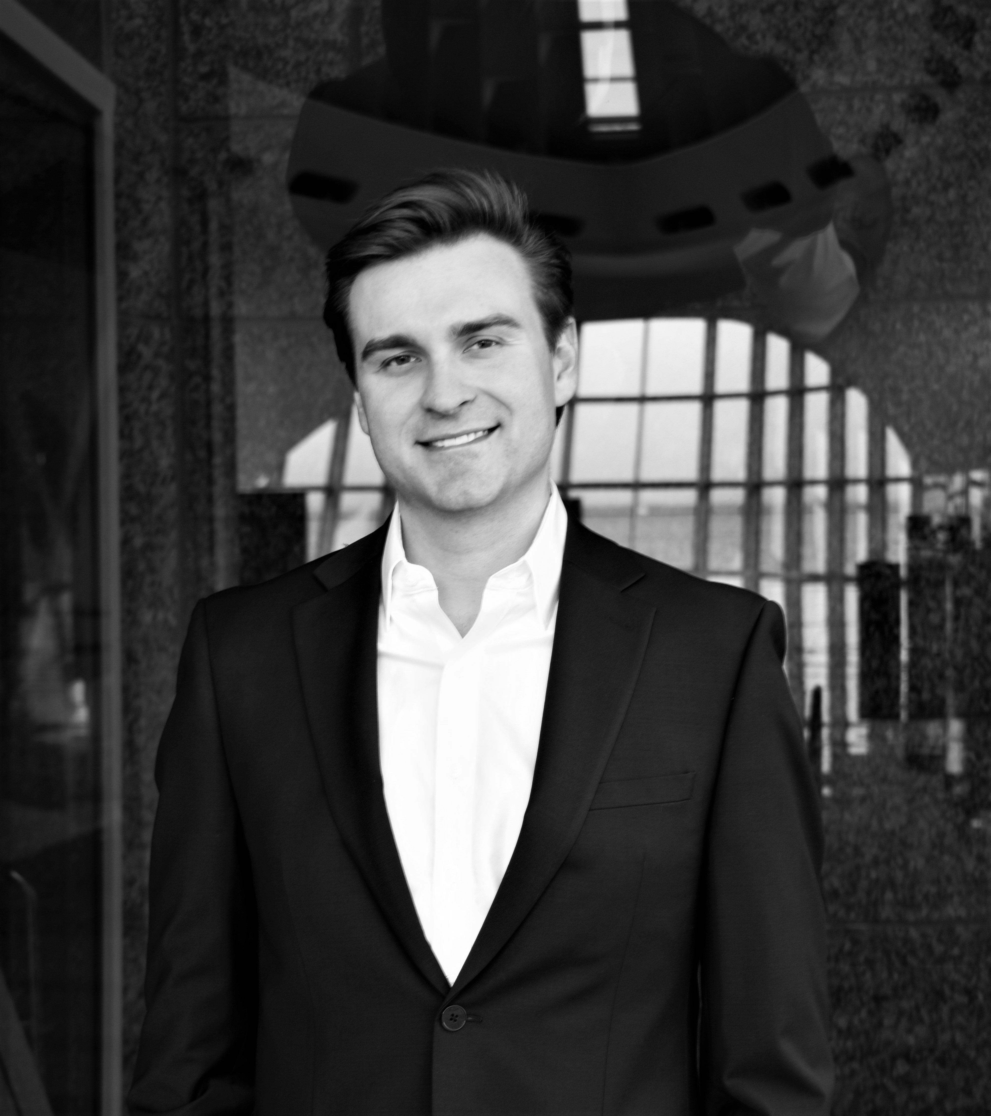 Black and white photo of man in blazer