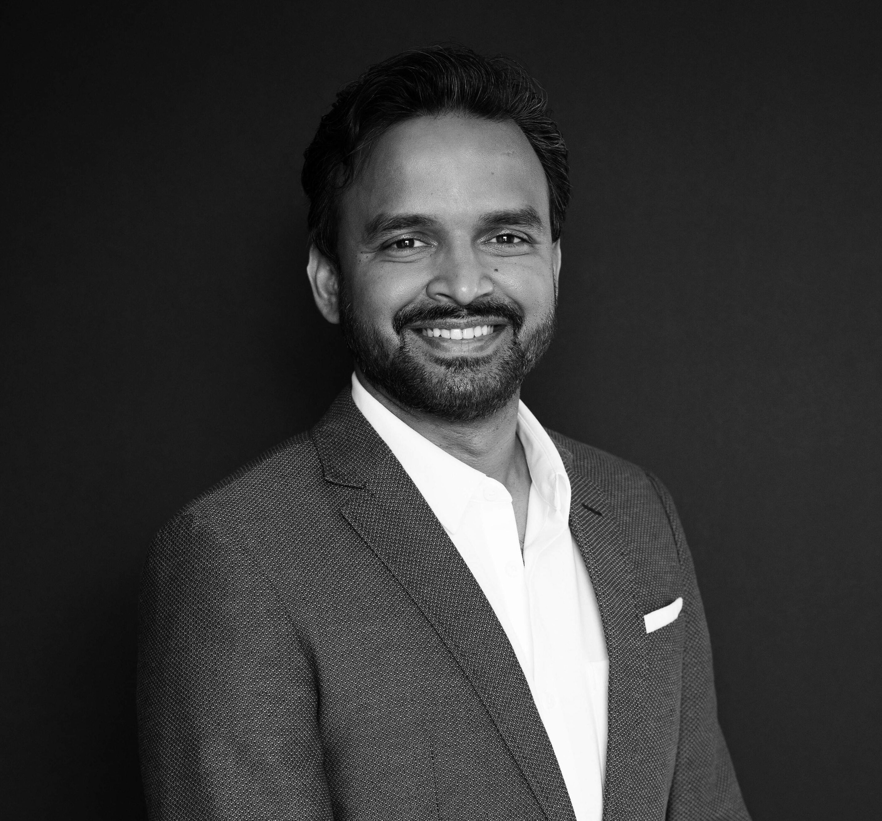 Black and white photo of a man in a suit