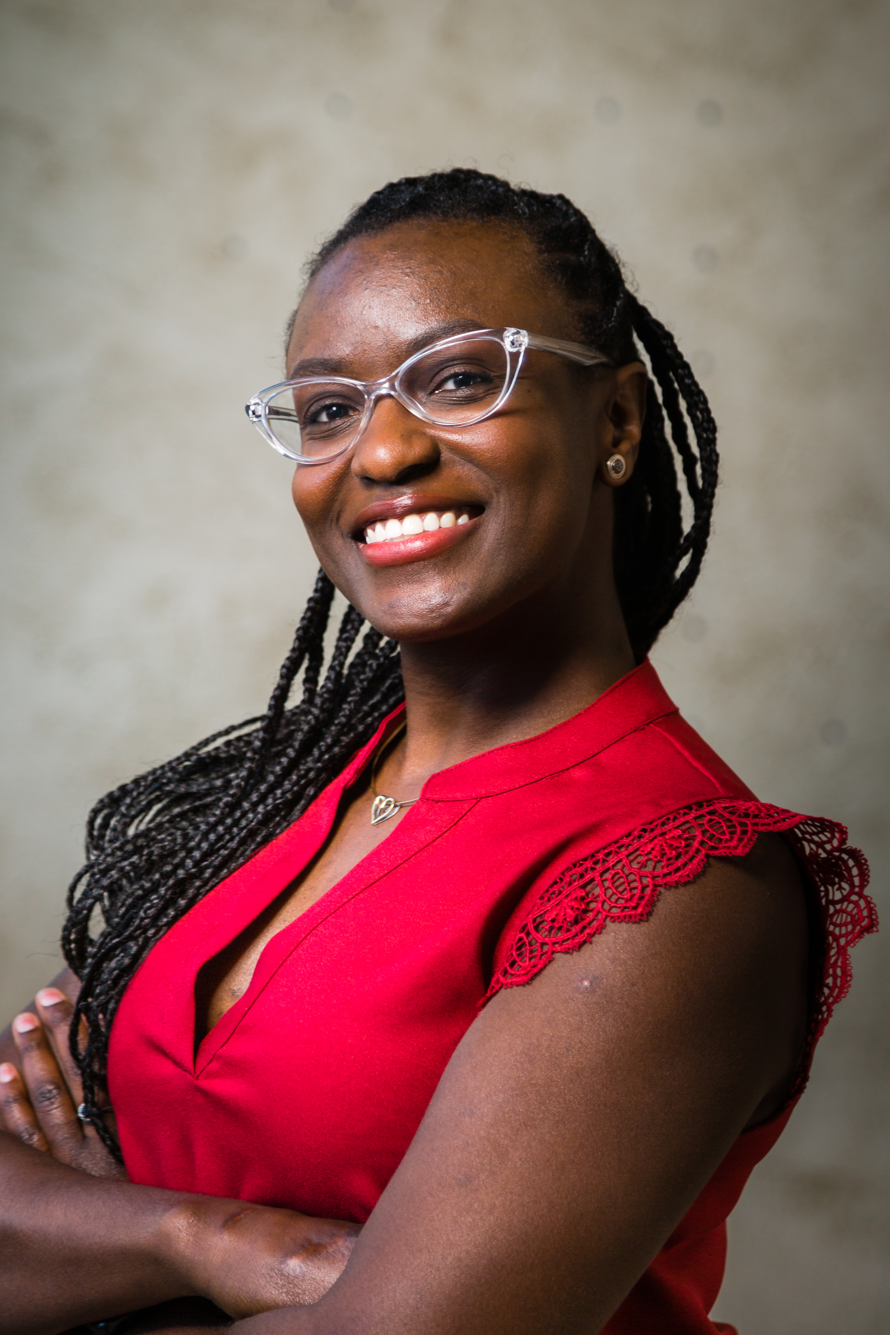Woman wearing red shirt and glasses