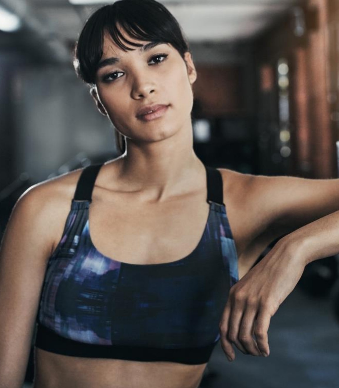 Woman in sports bra.