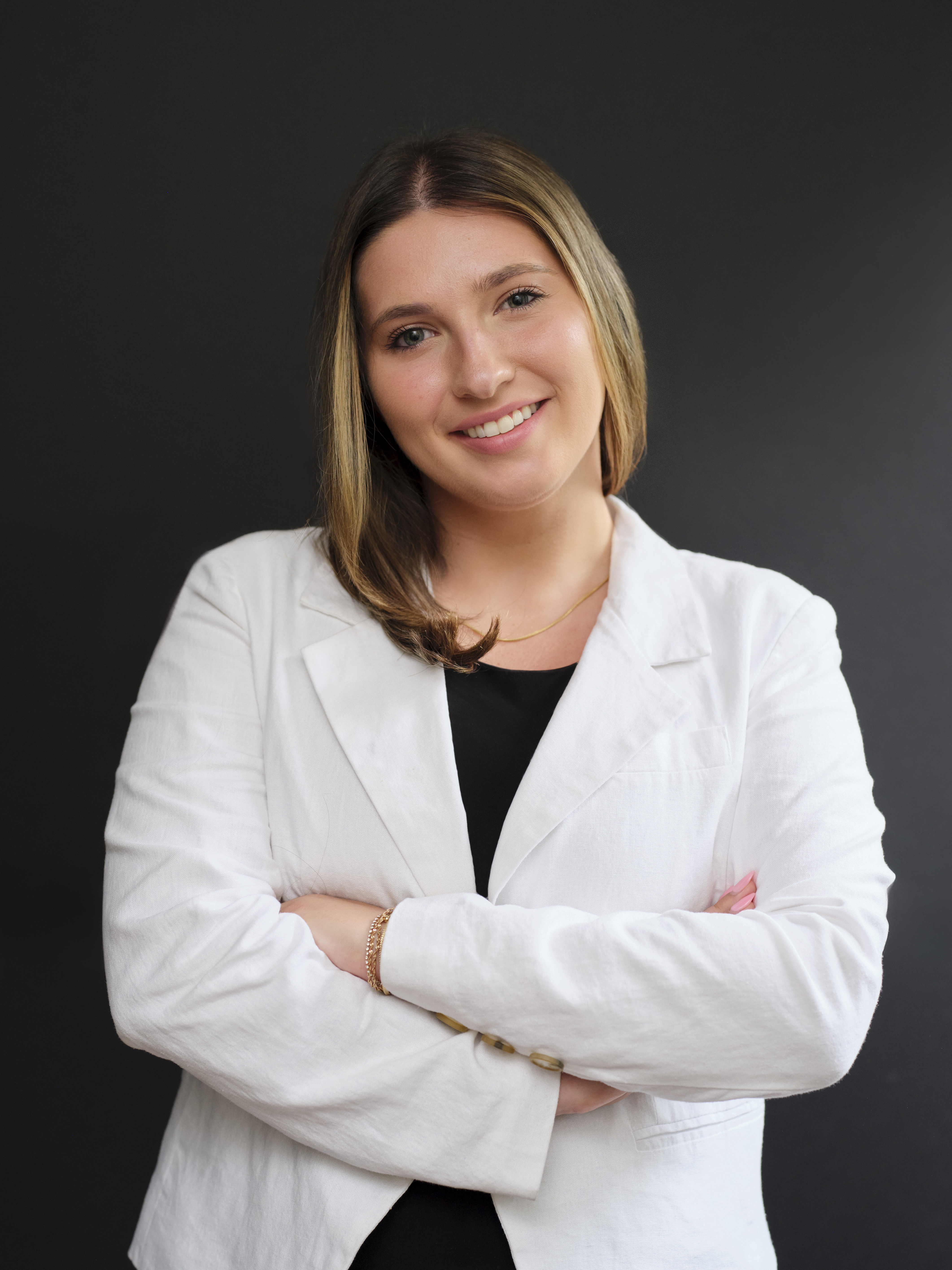 Woman in white lab coat